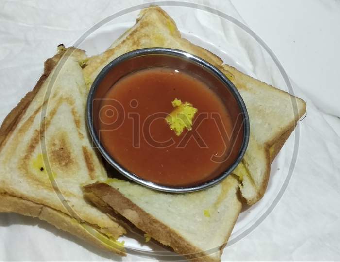 Indian style plain sandwich with red or green Sauce and  served in plate on white  background 15 Aug 2020