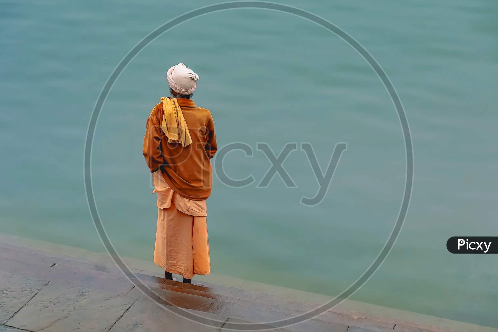 A Sadhu ready to pray on the banks of the holy river Ganges in Varanasi, India