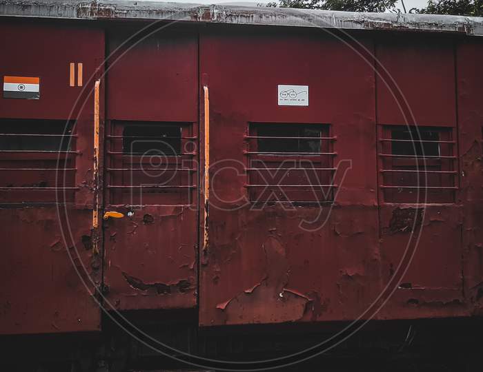 A photo of an old Indian train kept in the yard.