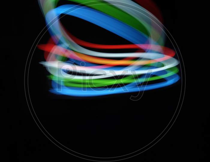 Mixture clight painting photography, long exposure, ripple circle and waves against black background