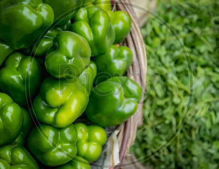 Green peppers and hot green chillies at a street vendor in India.
