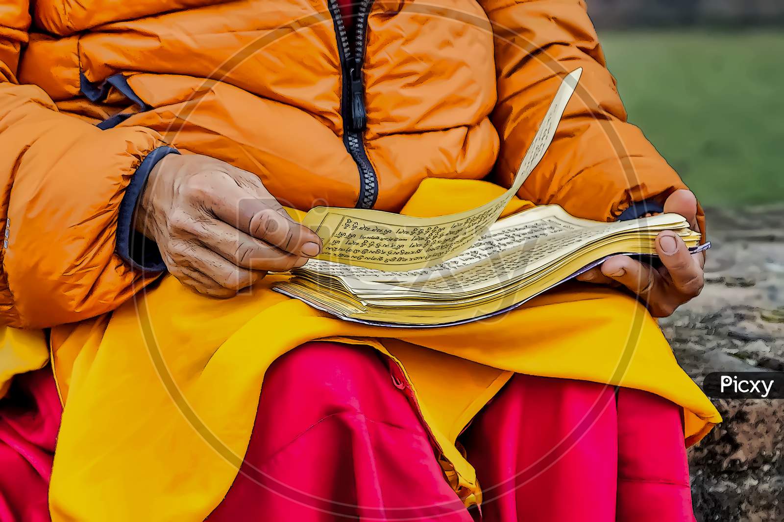 A Buddhist reading ancient scrolls in Sarnath where Gautama Buddha first taught the Dharma.