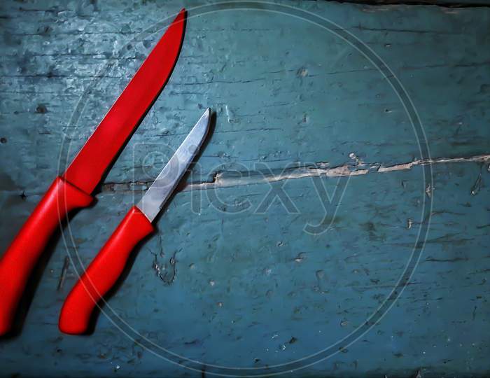 Placing knife on a wooden surface as a wallpaper.