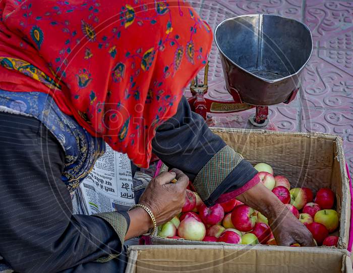 A street vendor selling fruits and vegetables on the streets of Leh, India