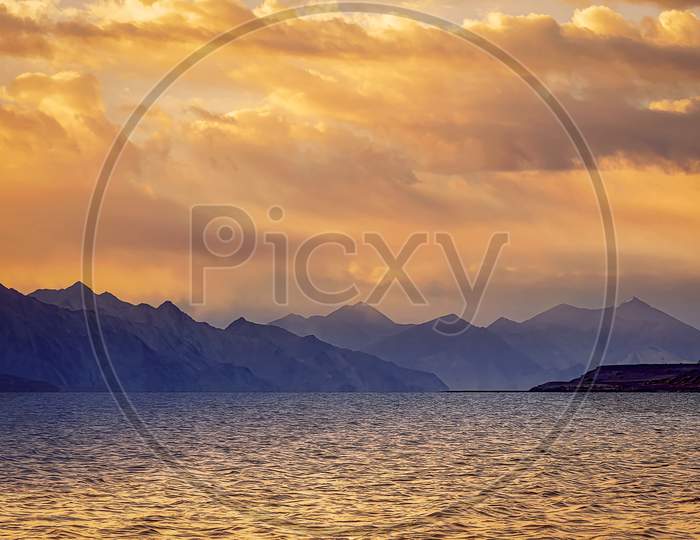 Beautiful Reflations In a Golden Sunrise Over Himalayas Pangong Lake near Leh City