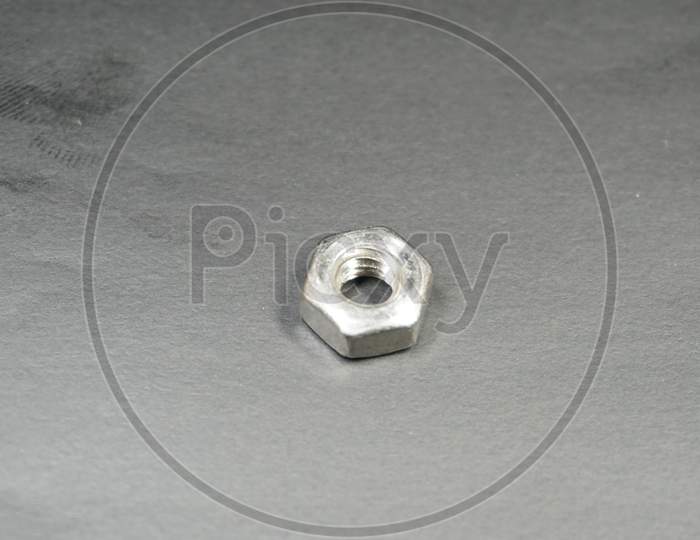 Zinc plated hexagonal shape nut bolt with clear background