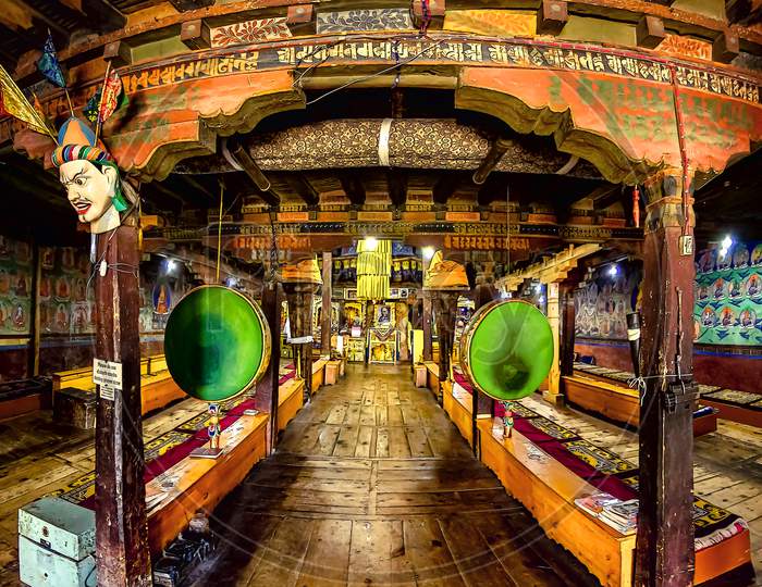 The old antique, rich and colourful interior of the Thiksey Monastery in Ladakh, India