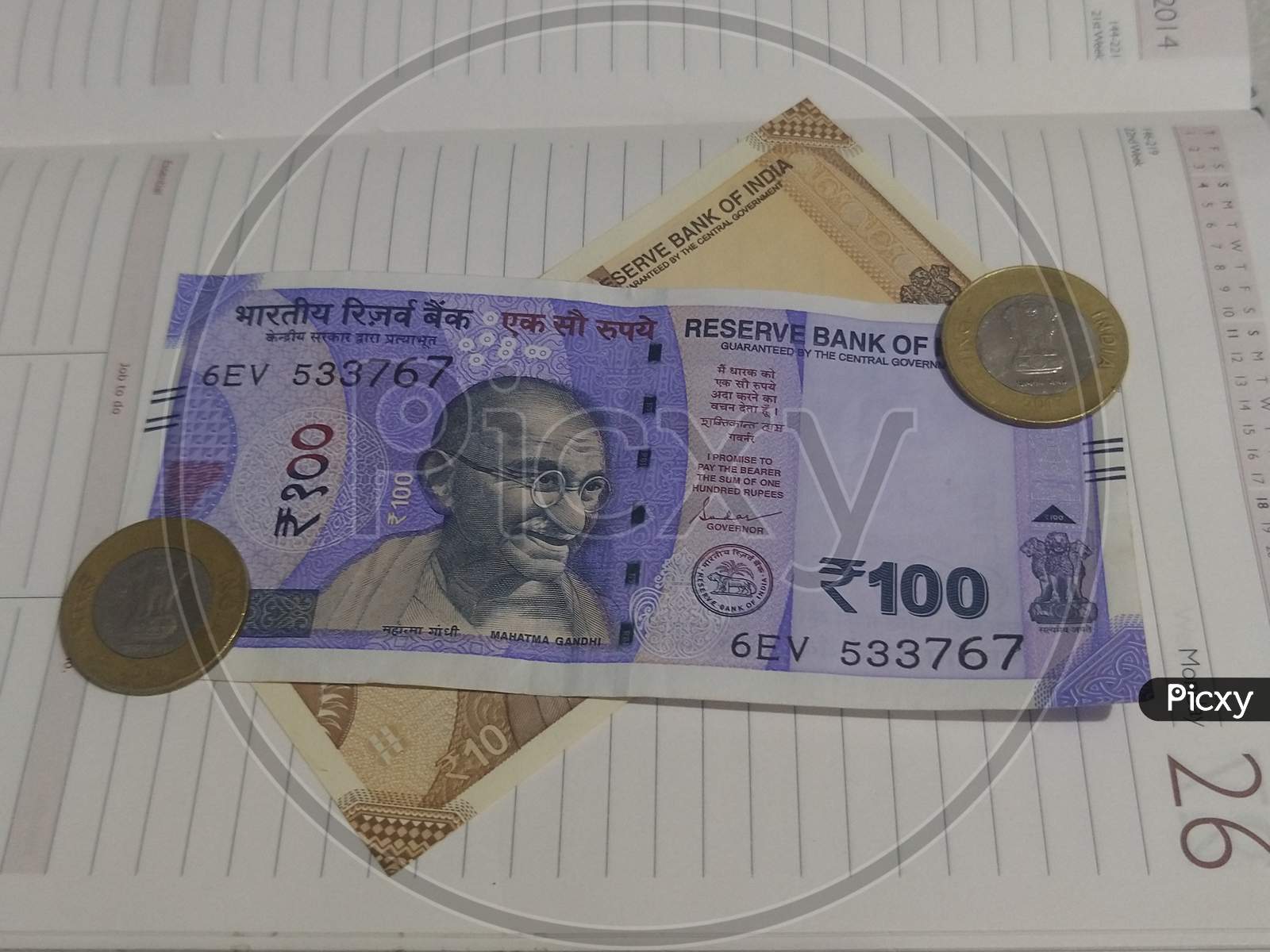 The Indian currency on opened page of diary.