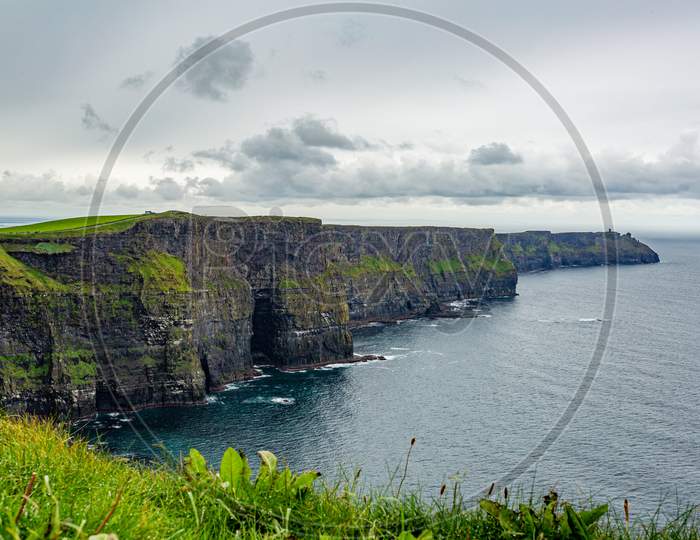 Irish Landscape Of The Cliffs Of Moher, Geosites And Geopark, Wild Atlantic Way, Wonderful Cloudy Spring Day In The Countryside In County Clare In Ireland