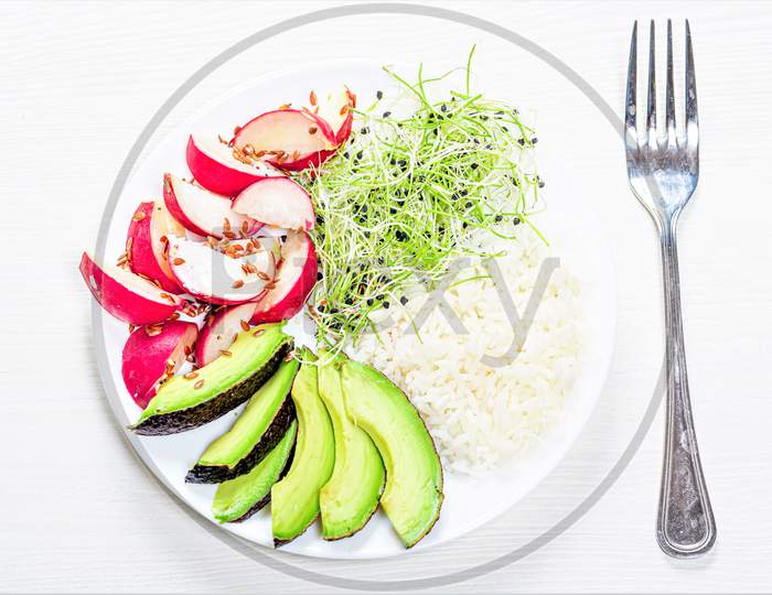 The View From The Top Rice With Slices Of Radish, Avocado And Micro-Greens Onions