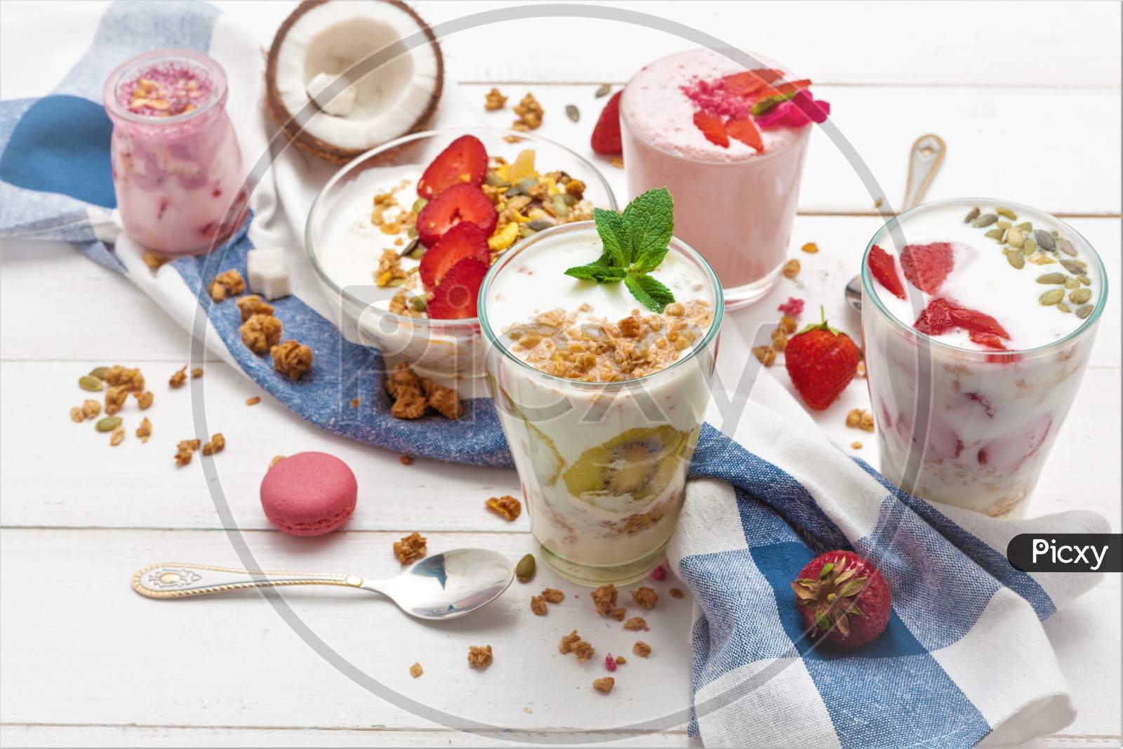 Yogurt Strawberry Muesli Breakfast. Many Highball Glass In Morning Breakfast On White Background.