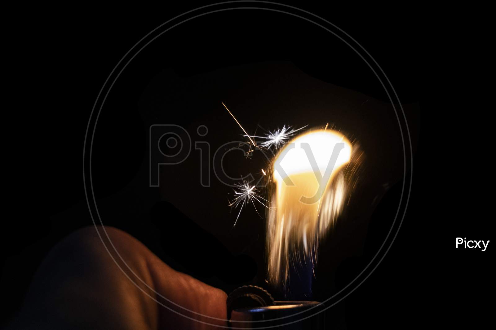 Fire Sparkle On A Lighter In Black Background