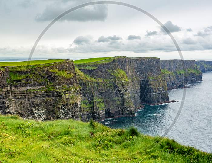 Beautiful Irish Landscape Of The Cliffs Of Moher, Geosites And Geopark, Wild Atlantic Way, Wonderful Cloudy Spring Day In The Countryside In County Clare In Ireland
