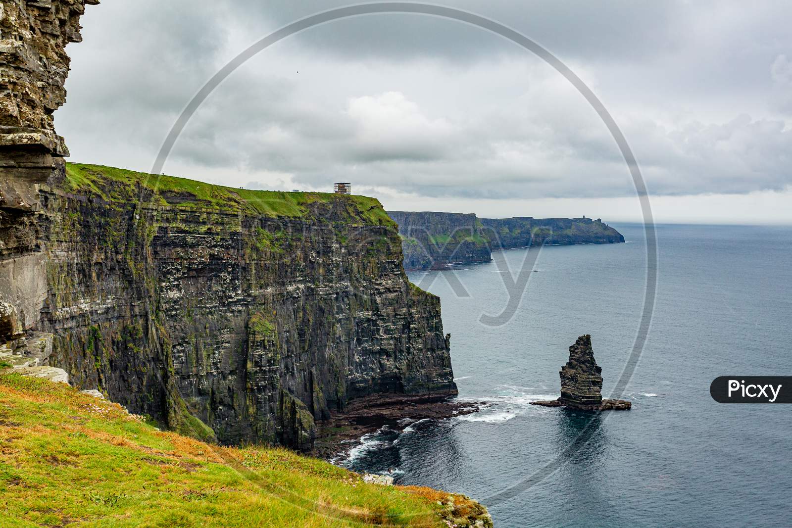 Stunning Irish Landscape Of The Cliffs Of Moher And The Branaunmore Sea Stack, Geosites And Geopark, Wild Atlantic Way, Wonderful Cloudy Spring Day In County Clare In Ireland