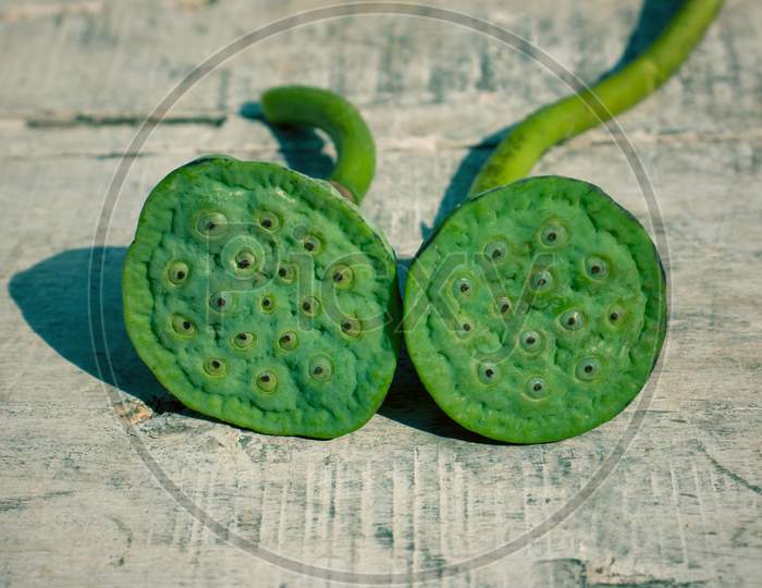 Nelumbo Nucifera Pods Or Indian Lotus Pods On Wooden Surface
