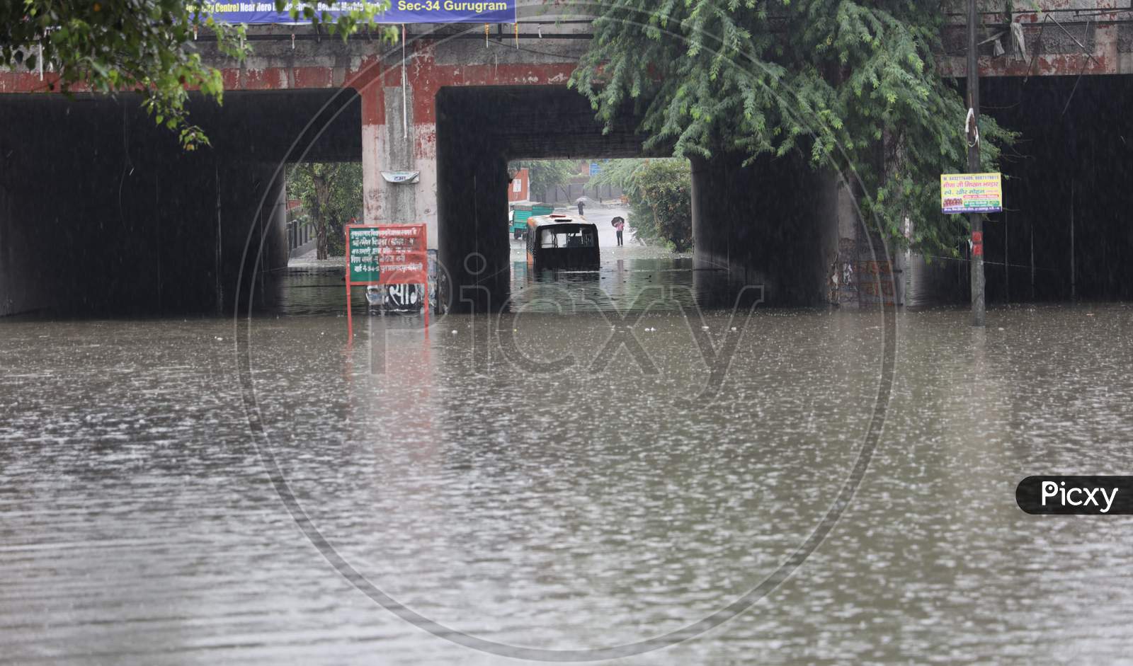 A bus stuck in a Prahladpur water-logged underpass after heavy rains in New Delhi, India, August 19, 2020.