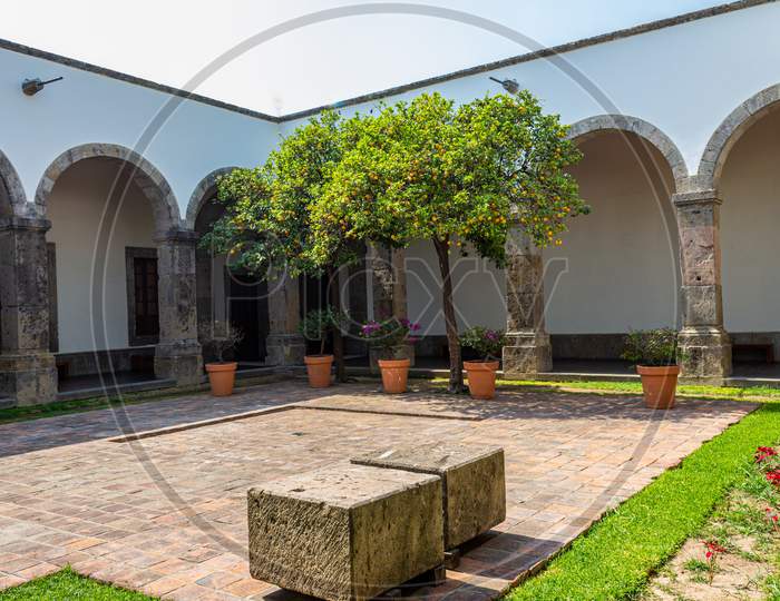 Inner Courtyard With Columns Between Arches And Corridors, The Cultural Institute Cabañas On A Sunny And Cultural Day In Guadalajara, Jalisco, Mexico