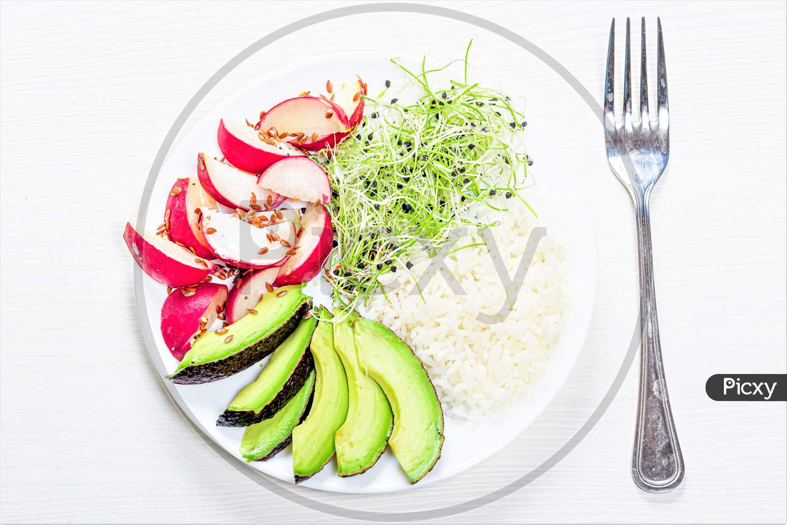 The View From The Top Rice With Slices Of Radish, Avocado And Micro-Greens Onions
