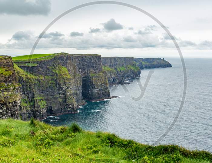 The Famous And Tourist Cliffs Of Moher, Geosites And Geopark, Wild Atlantic Way, Wonderful Spring Cloudy Day In The Countryside In County Clare In Ireland