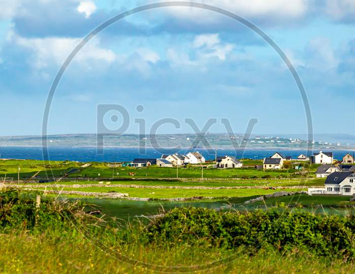 Beautiful Meadow, Farms And The Sea In The Background Near The Village Of Doolin, Wild Atlantic Way, Beautiful Sunny Spring Day In County Clare In Ireland