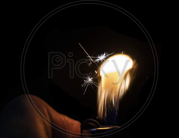Fire Sparkle On A Lighter In Black Background