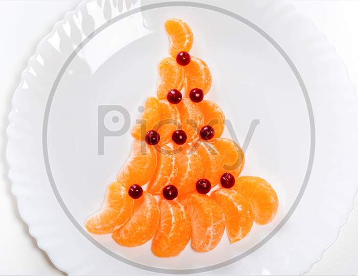 Christmas Tree Made From Mandarin And Cranberries