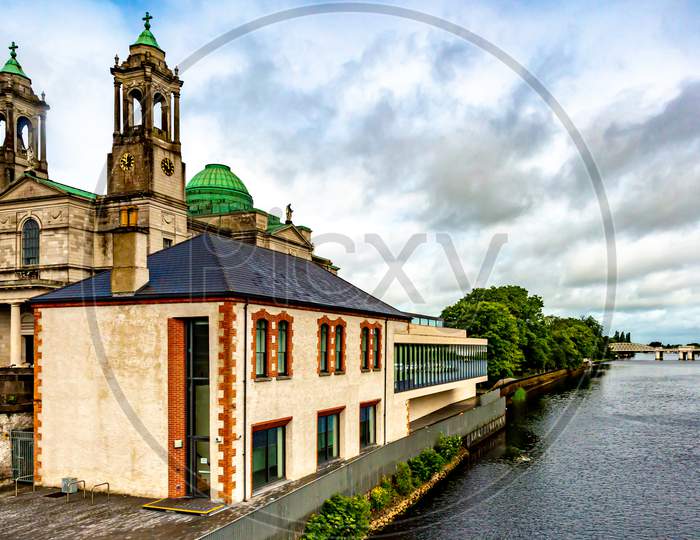 The Parish Church Of Ss. Peter And Paul With Their Green Domes Beside The River Shannon In Athlone Town, Wonderful Cloudy Day In The County Of Westmeath, Ireland