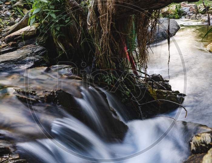 Waterfall Landscape. Beautiful Hidden Waterfall In Tropical Rainforest. Jungle River. Adventure And Travel To Asia. Slow Shutter Speed, Motion Photography.