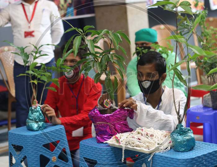 Differently abled boys tie Rakhi to plants in Kolkata on August 4, 2020.