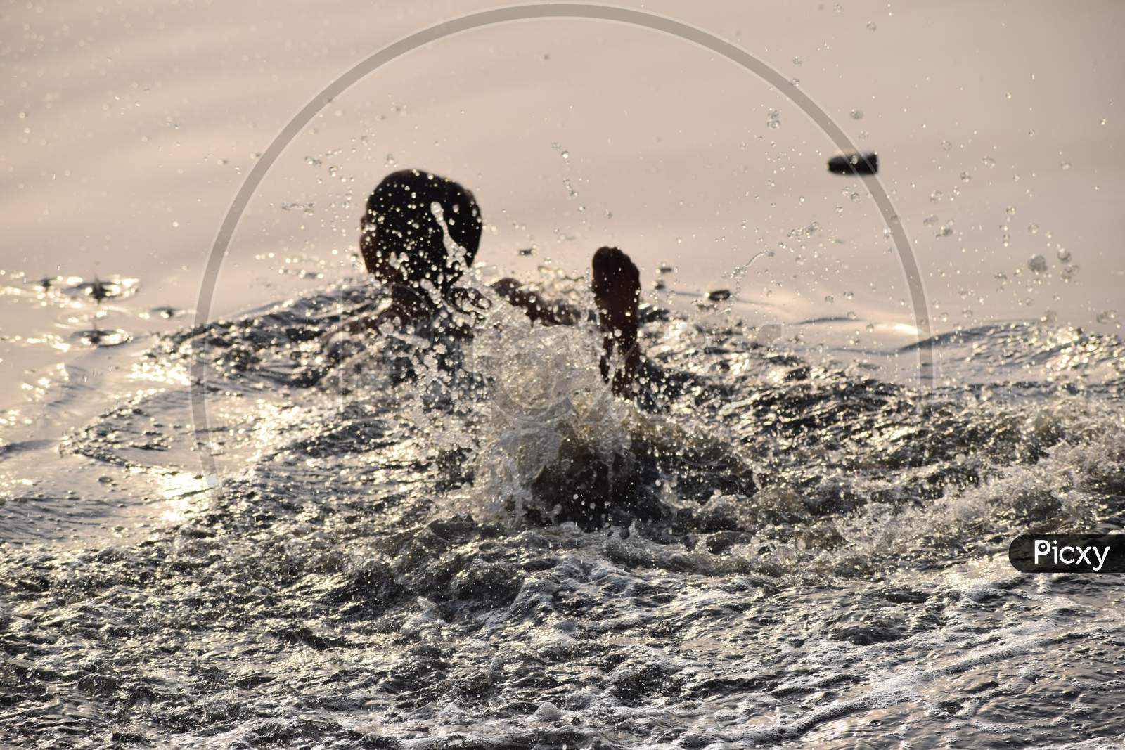 Delhi, India - Dec 31, 2019 : Man Taking Bath In Holy River Of Yamuna During Morning Time In Delhi India, People Taking Holy Dip Inside Yamuna River