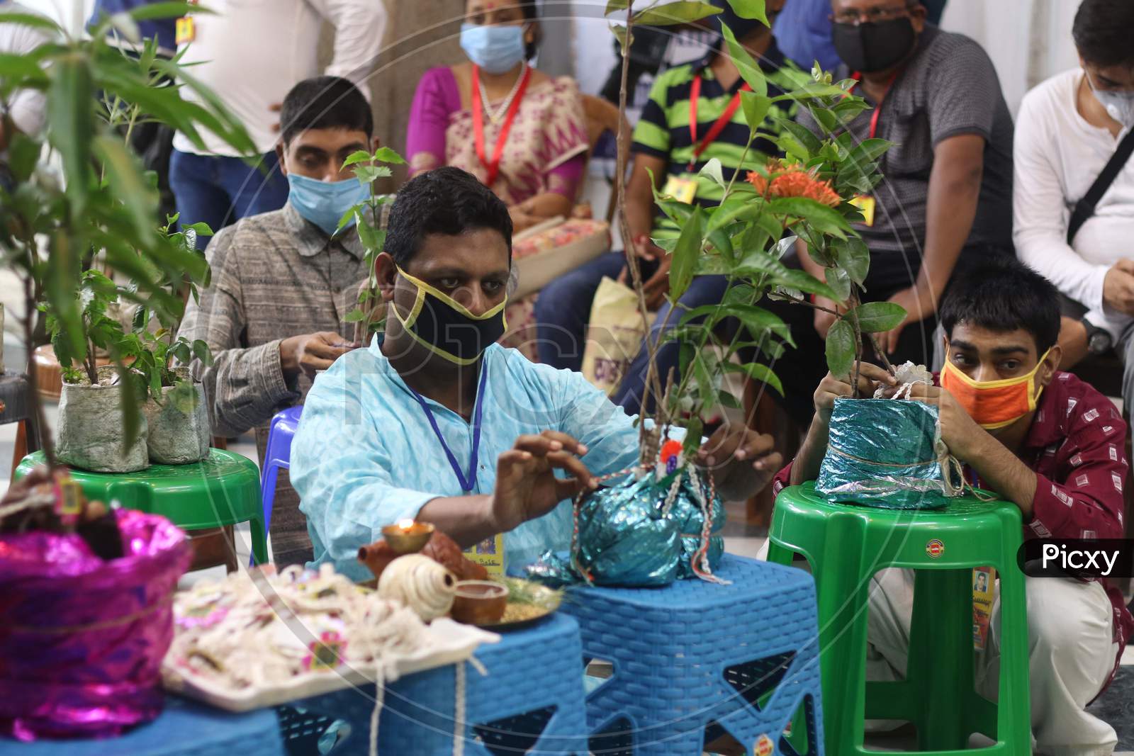 Differently abled boys tie Rakhi to plants in Kolkata on August 4, 2020.
