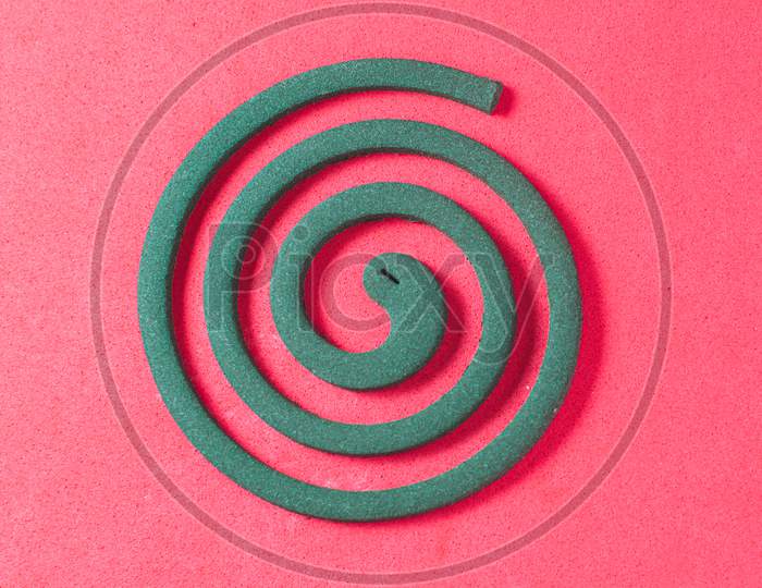 Mosquito Coil On A Red Background Top View