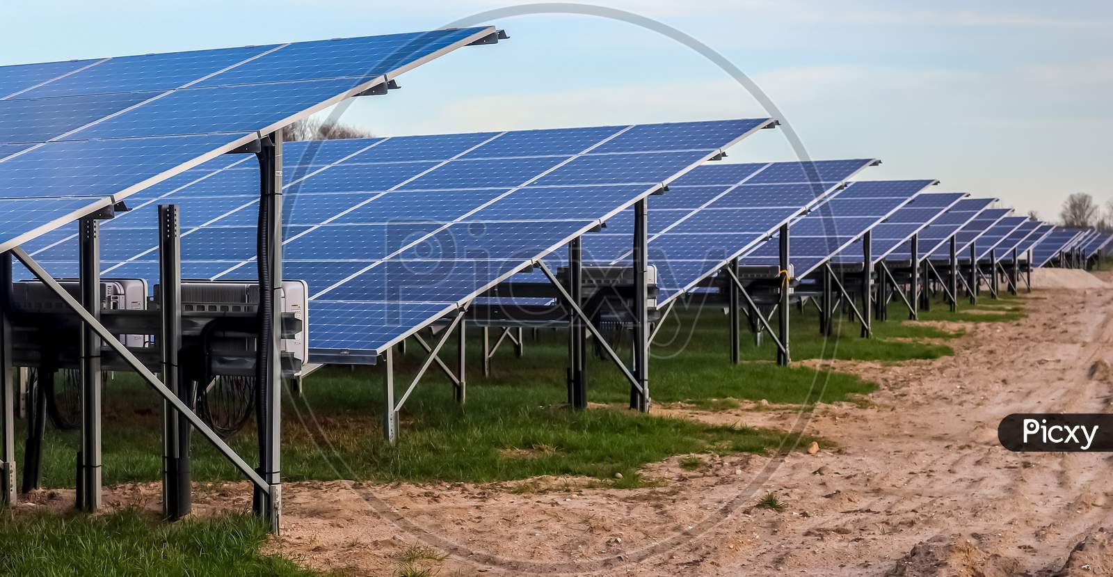 Generating Clean Energy With Solar Modules In A Big Park In Northern Europe