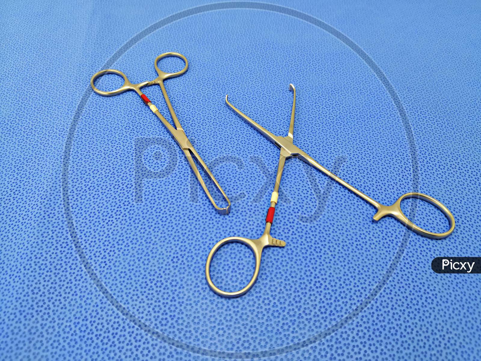 Two Allis Forceps On Table