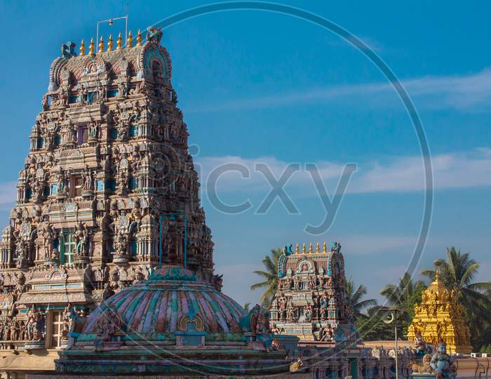 Indian Temple exterior with blue sky copy space, South indian colorful temple , temple gopuram