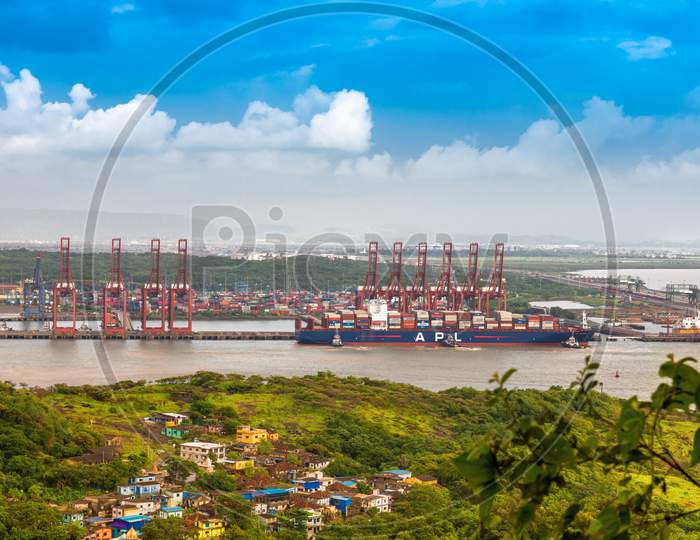 A wide view of Mumbai's local bus stop and port area. Mumbai Port is the largest container port in India situated near Mumbai.