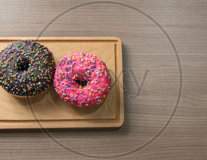 Delicious Donuts On Wood