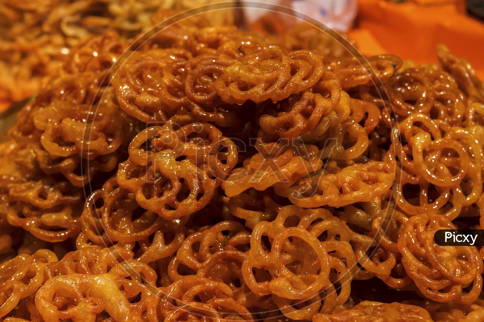 Jalebi is an Indian sweet and delicious food made of Maida flour and sugar syrup