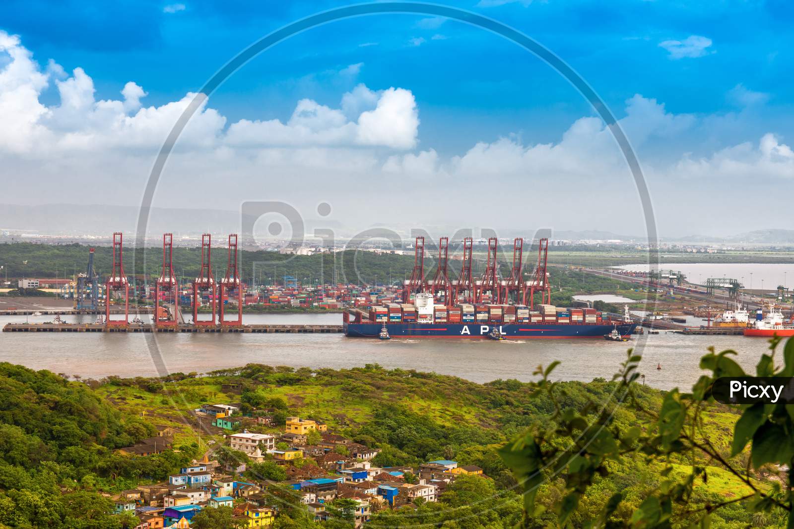 A wide view of Mumbai's local bus stop and port area. Mumbai Port is the largest container port in India situated near Mumbai.