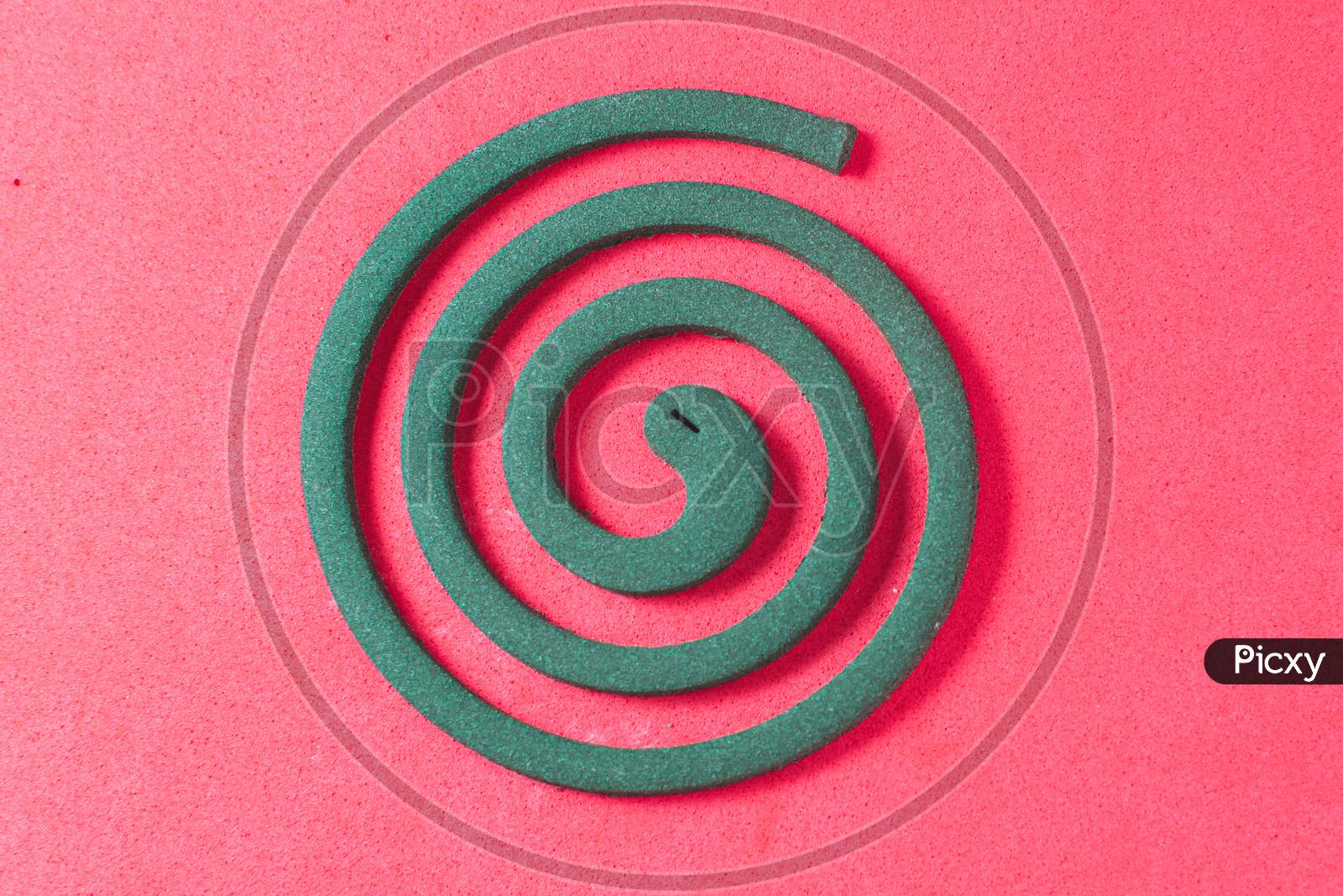 Mosquito Coil On A Red Background Top View