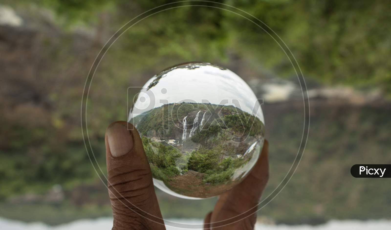 Shimsha waterfall seen through a Crystal ball in Shivanasamudra/Karnataka/India.