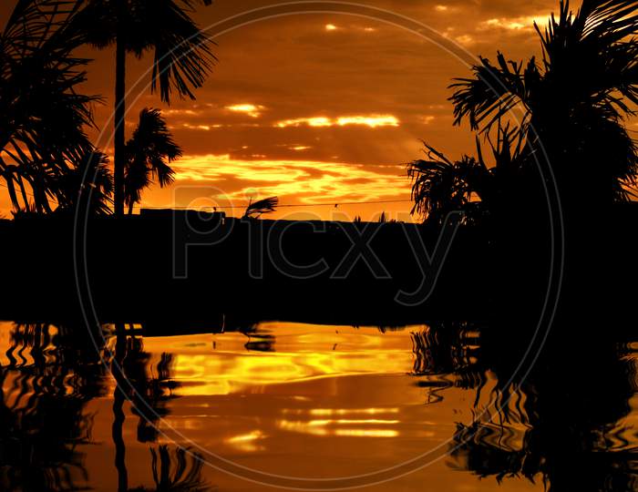 sunset over water clipart 8