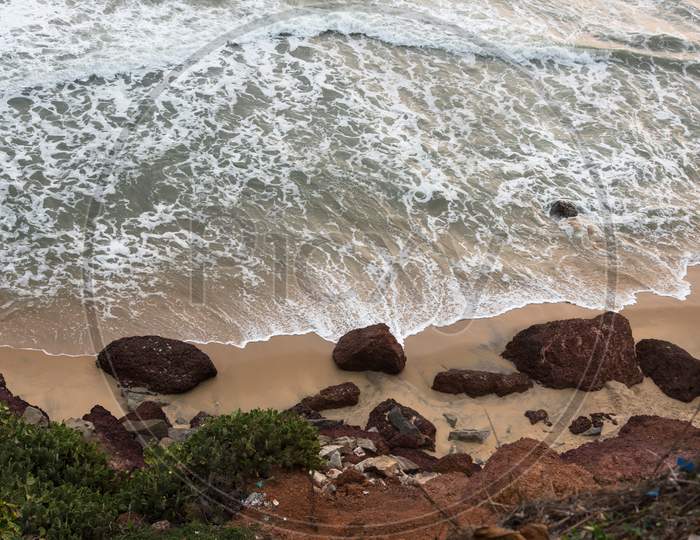 Top view of sea waves and rocks