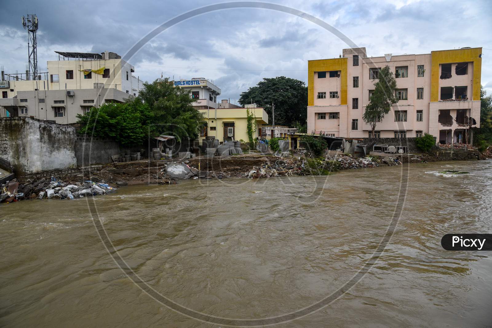 flood water flowing through the drainage in Nayeem Nagar, Warangal, August 18, 2020
