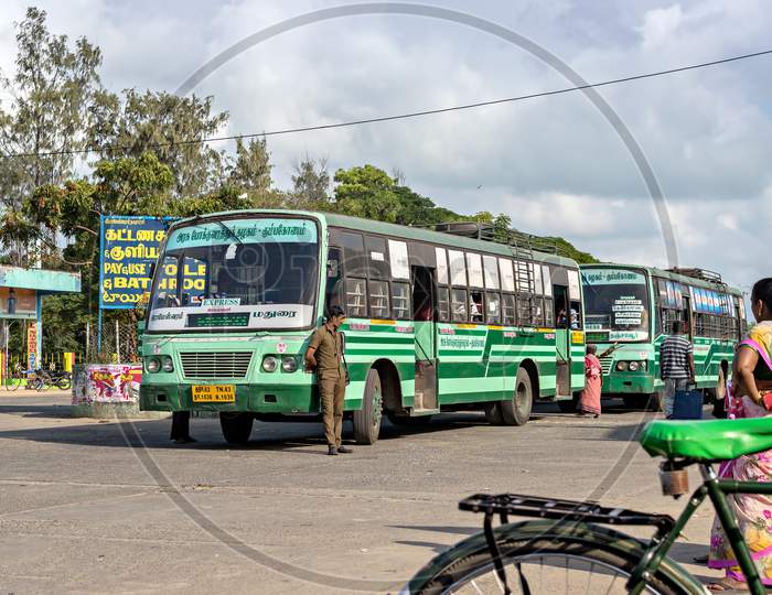 Conductor Of Green Inter-City State Transport Bus Waits For Passenger Near Door.