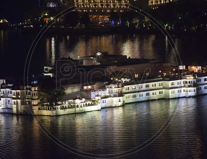Night View Of Taj Lake Palace Hotel On Lake Pichola - Udaipur, Rajasthan.