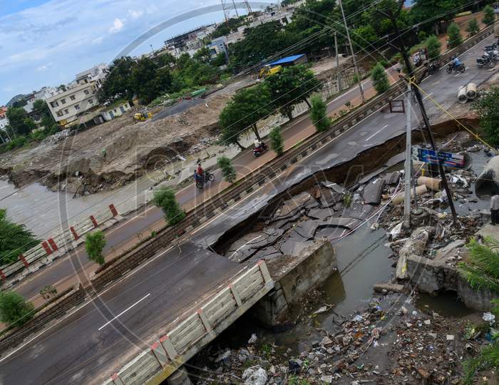 A part of the 100 Ft. Road in Hanamkonda shrinks and washes away after a heavy flood. Hanamkonda, Warangal, August 18, 2020.