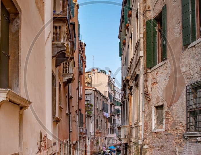 Beautiful Venetian Street In Summer Day, Italy - Gondola Riders