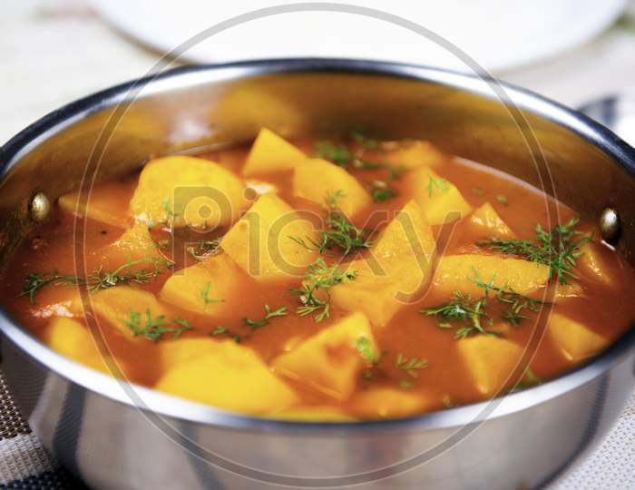 Potato And Tomato Curry In A Steel Bowl.