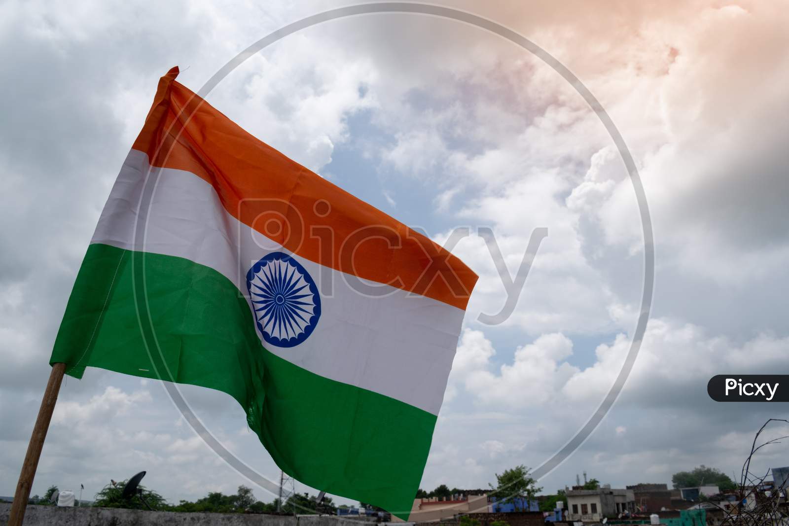 An indian flag under the clouds on the independence day 2020